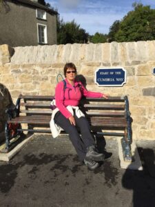 Christine at the start of the Cumbria Way