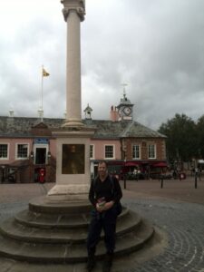 Alan at Market Cross - the official end of the Cumbria Way